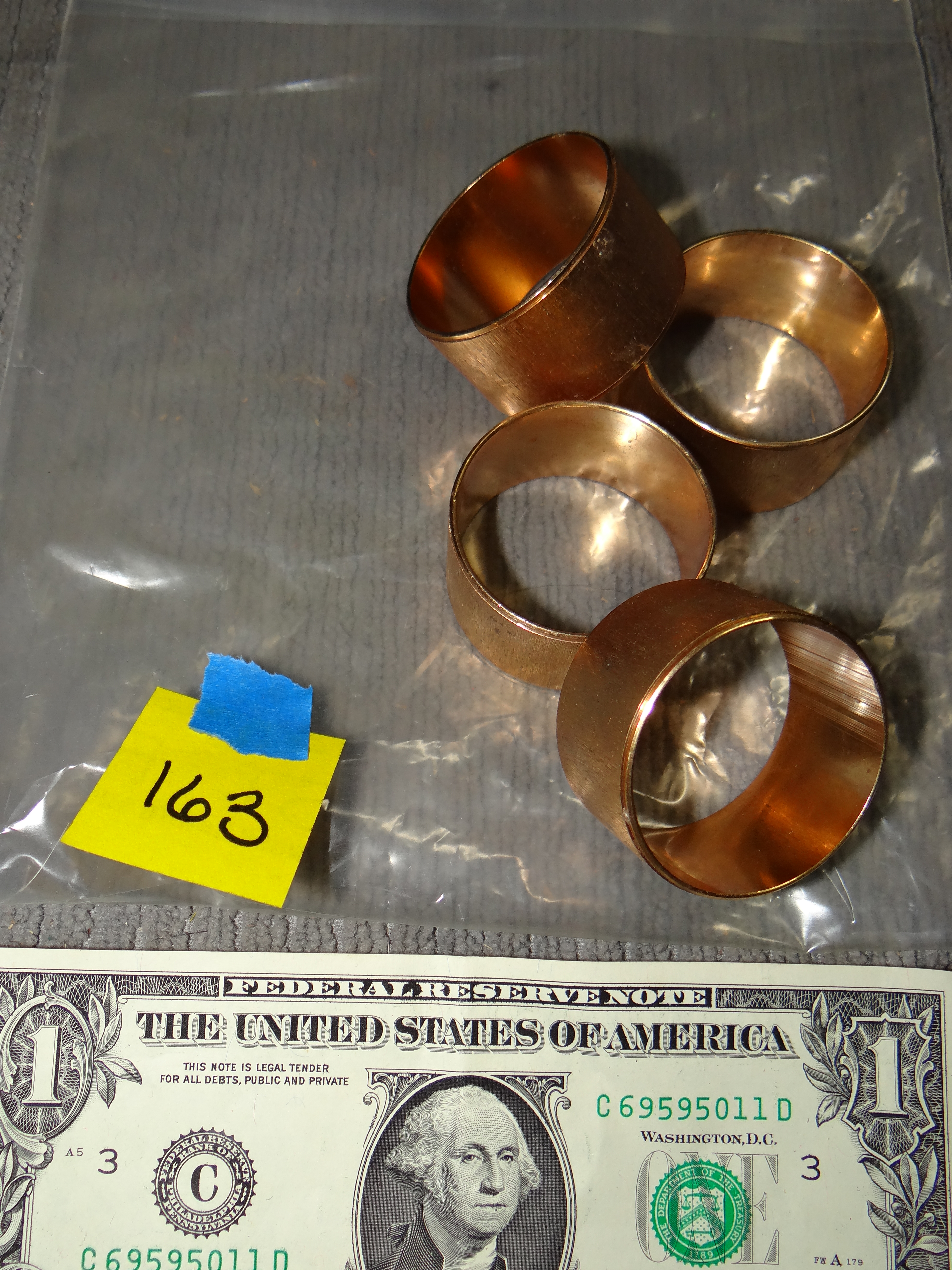 163-Four Brass? Copper? Napkin Rings