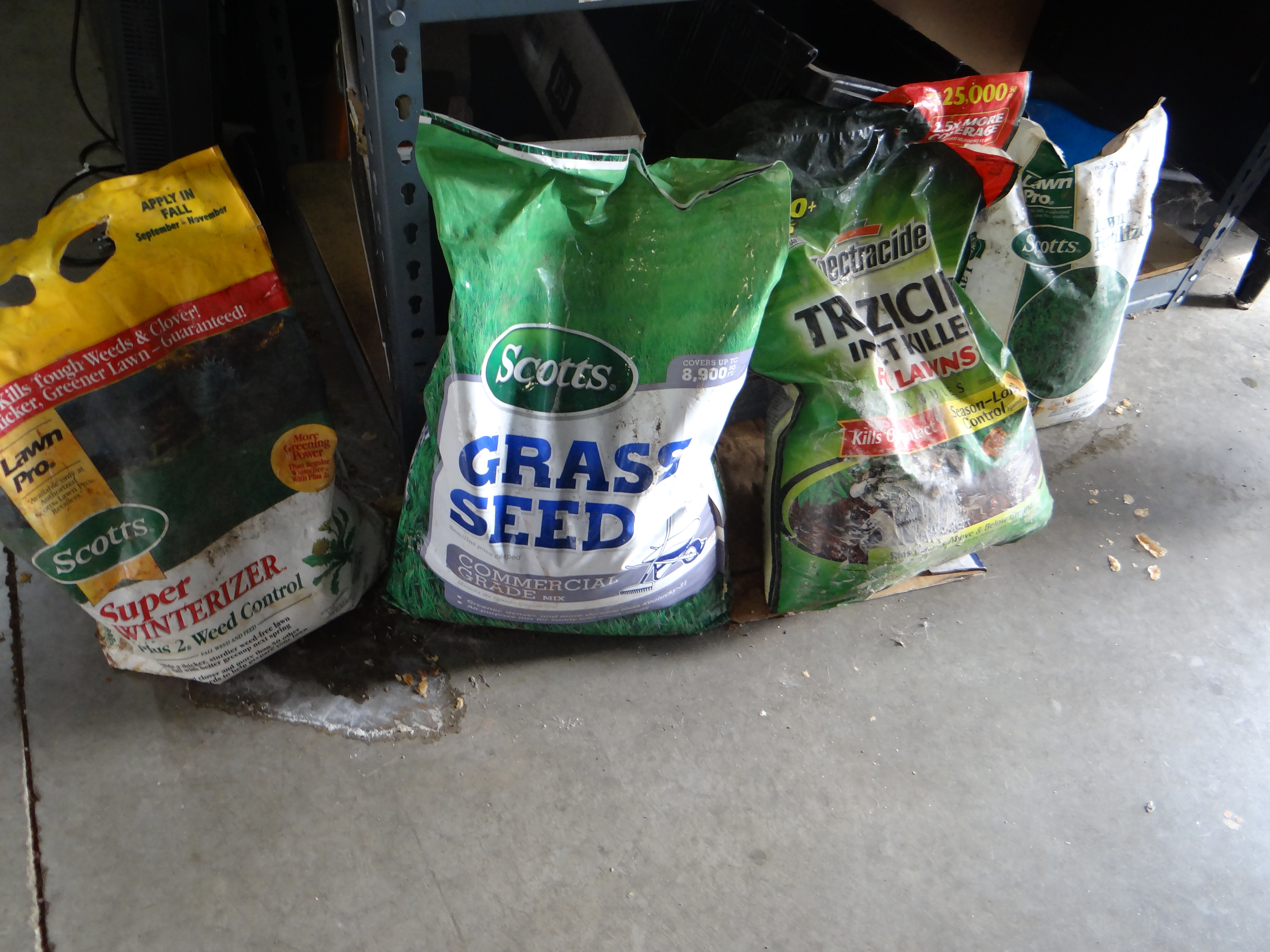 23-Four Partial Bags of Garden Fertilizers & Grass Seeds (see pics for details)